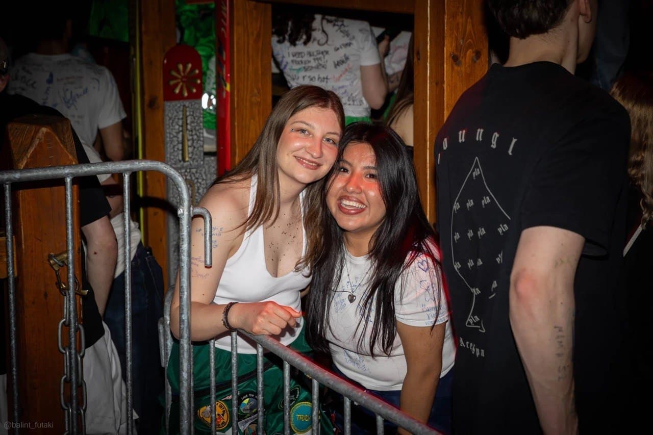 Two students smiling at a party