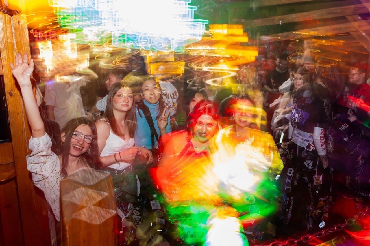 Crowded student party with light trails